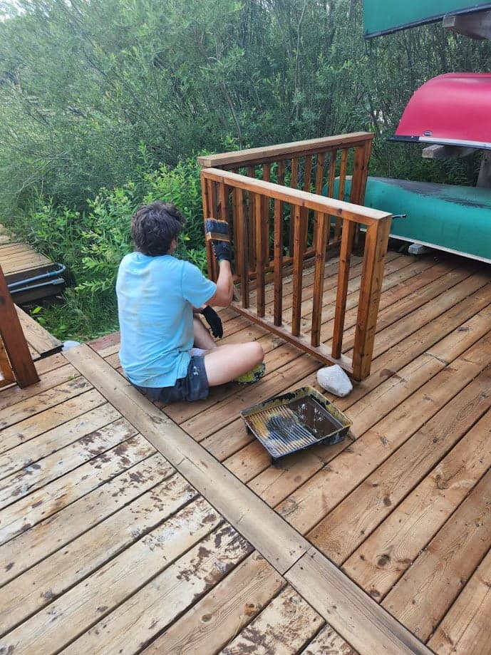Pressure washing deck boards before staining treatment