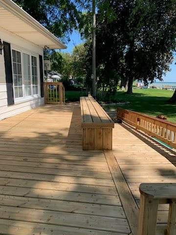 Stained deck boards with natural wood grain revealed - Hamilton Ontario